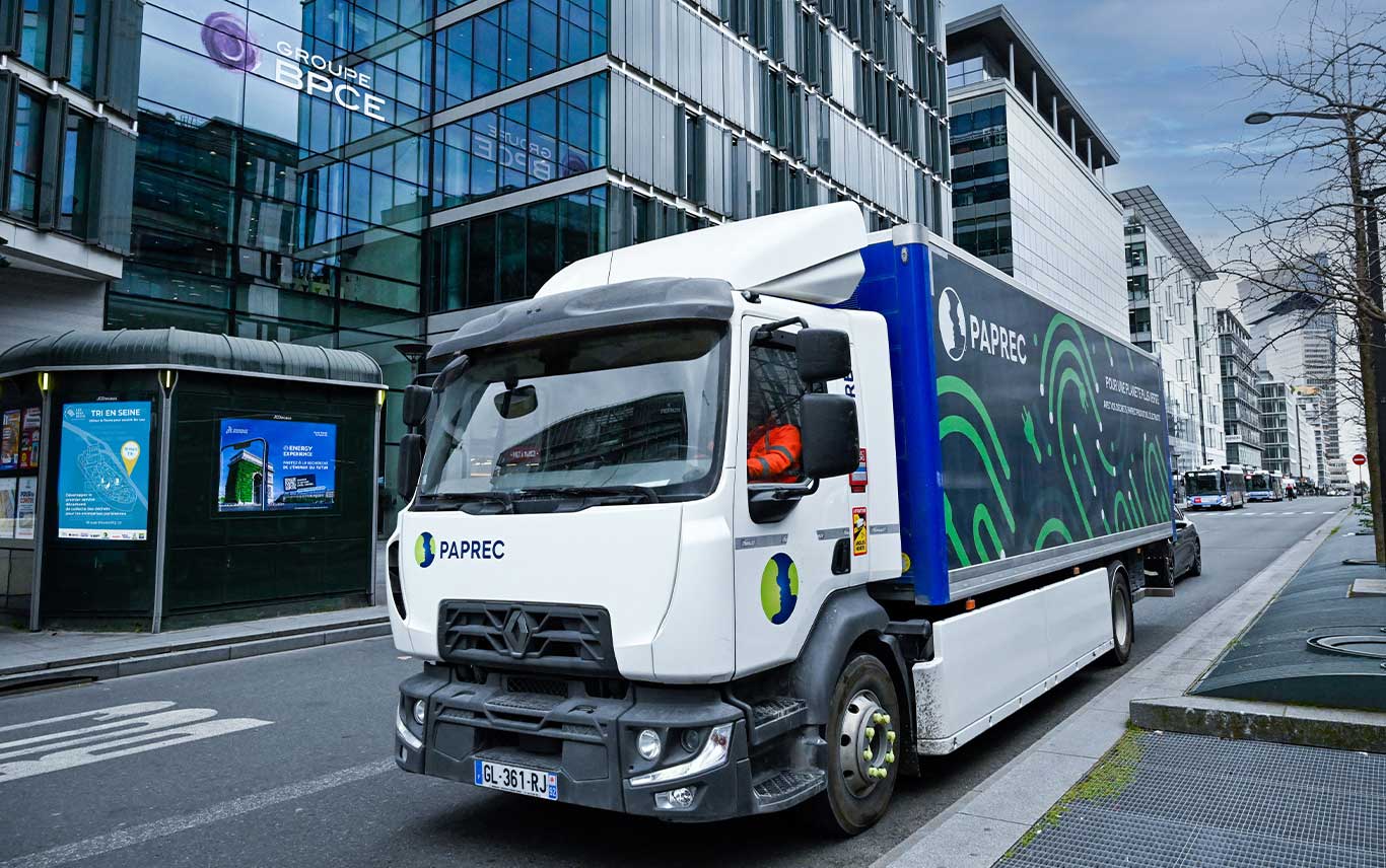 Electric garbage trucks towards river barge